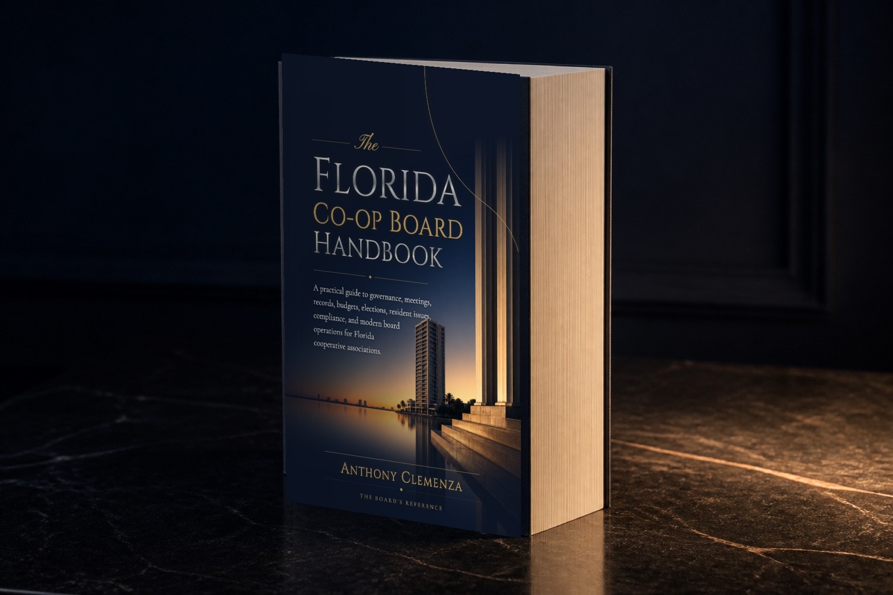 The paperback standing on dark marble, jacket forward and the page block clean at the fore-edge