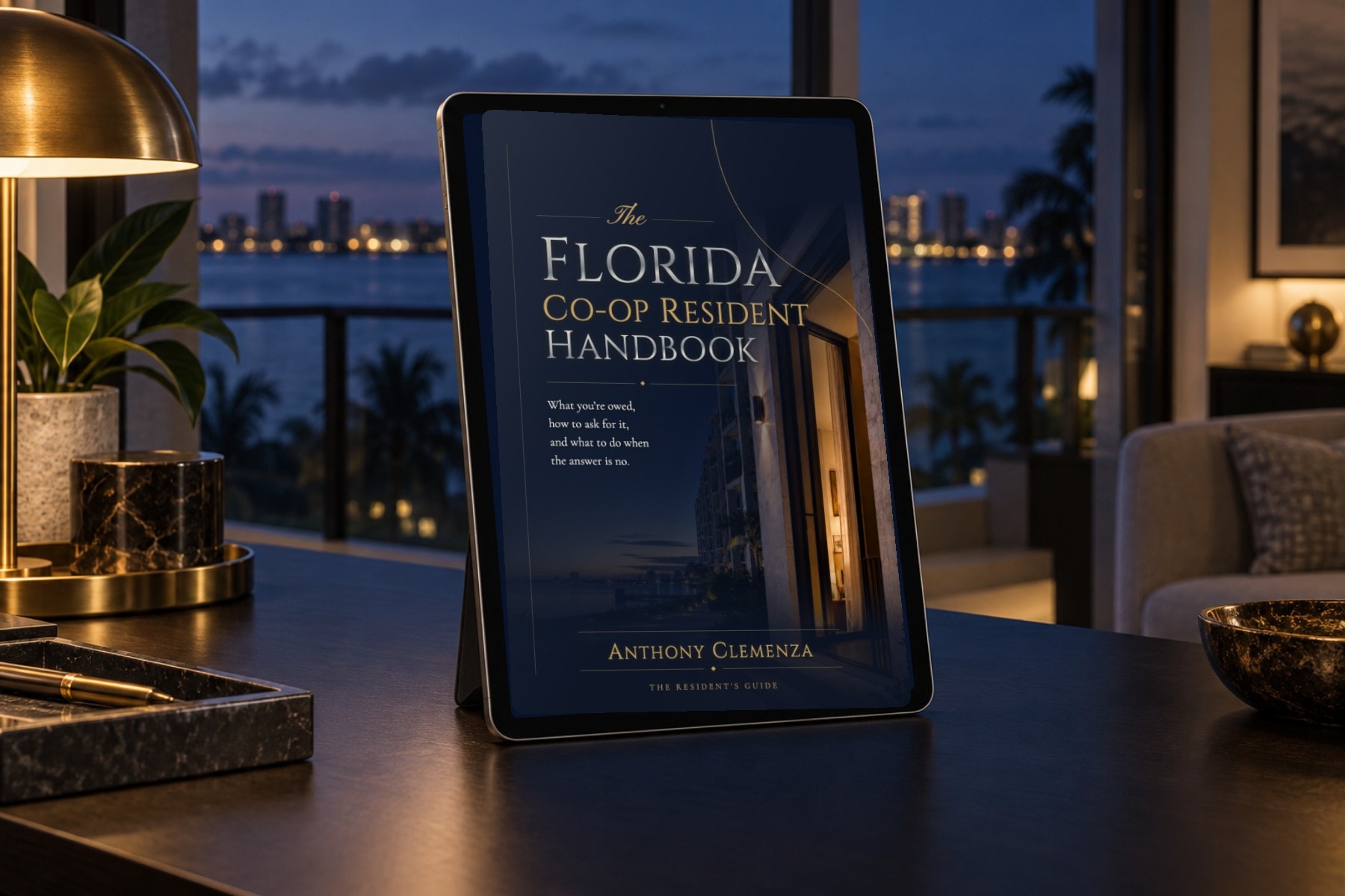 The Resident Digital Edition cover filling a tablet screen in an oceanfront residence at blue hour